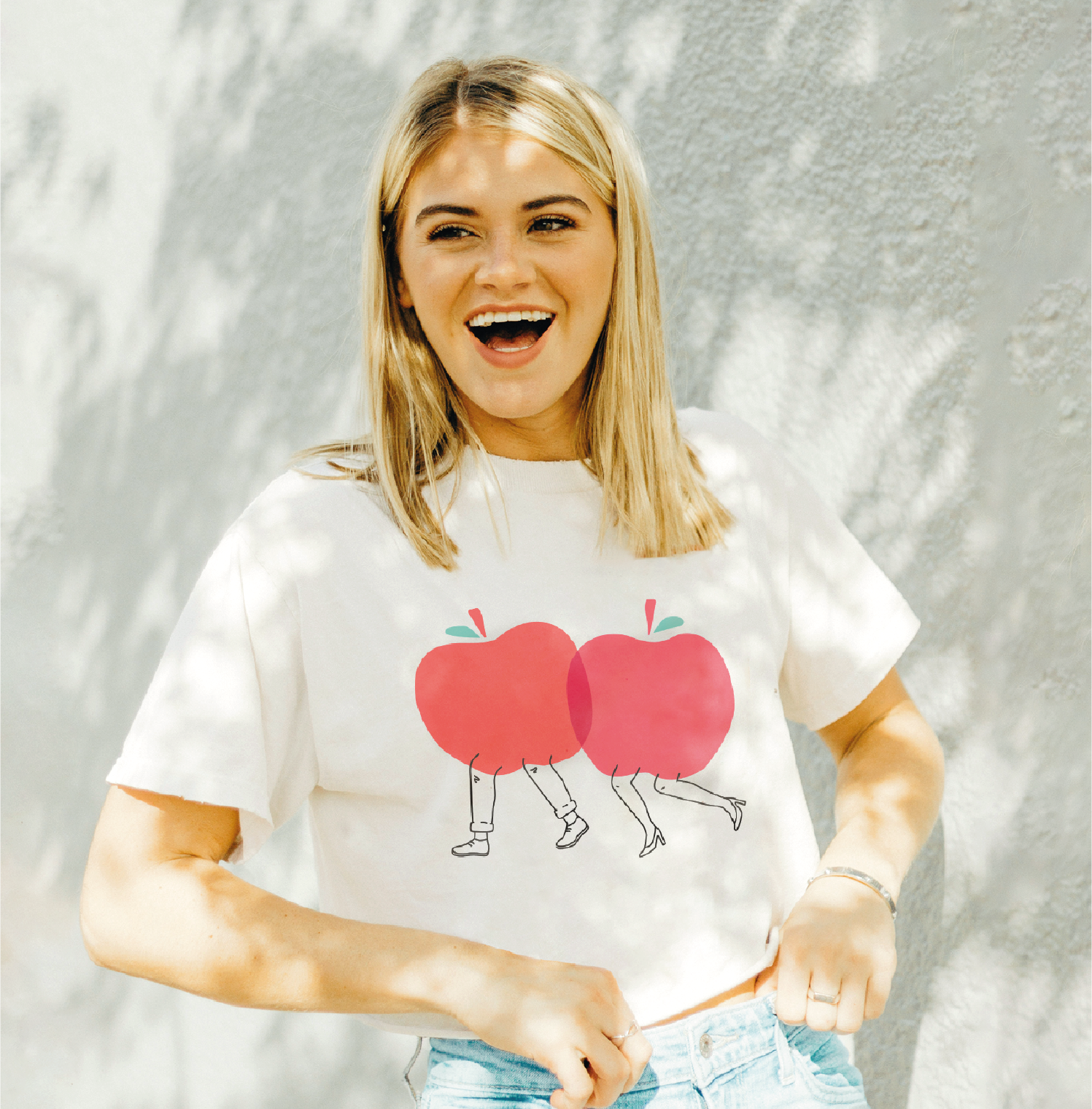 Woman wearing tshirt with apple illustration